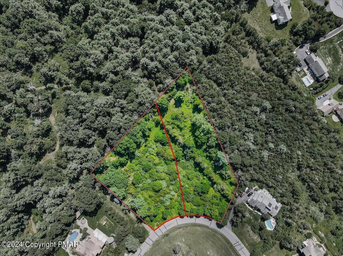 19-20 Kettle Ridge Drive Stroudsburg, PA 18360 - Photo 2 of 15 view of a forest with a houses