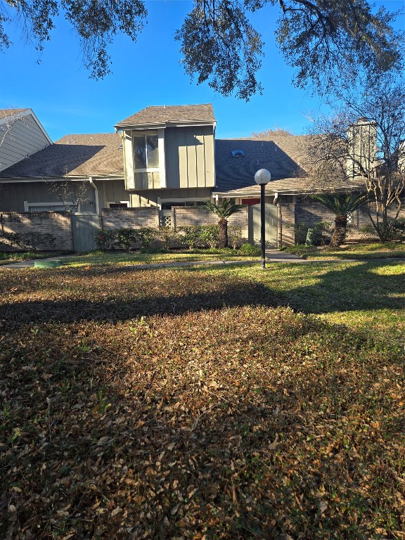 12906 Leader Street, Unit 2906 Houston, TX 77072 - Photo 3 of 16 a front view of a house with a yard