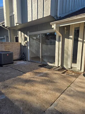 a view of a house with a parking space