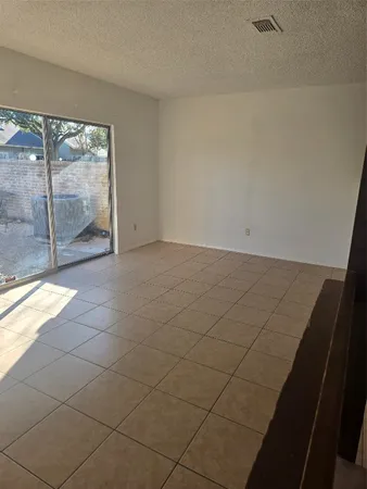 a kitchen with a cabinets and a refrigerator