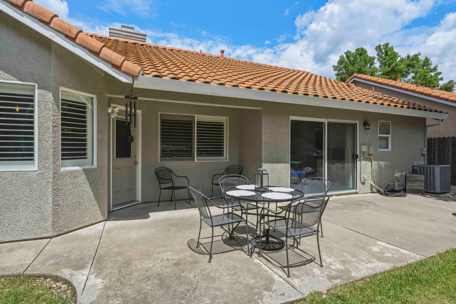 5013 Charter Road Rocklin, CA 95765 - Photo 32 of 35 a view of a patio with table and chairs and potted plants