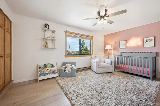 a bedroom with furniture and windows