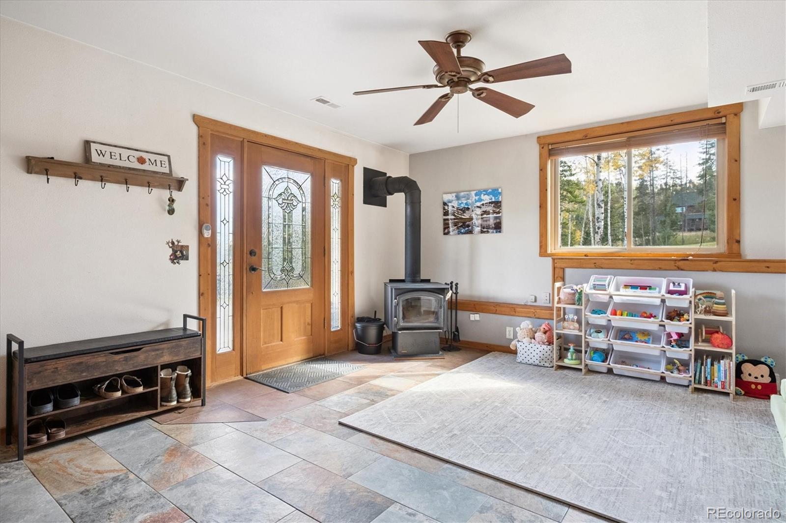 12369 Quartz Spur Conifer, CO 80433 - Photo 21 of 36 a living room with furniture and a window