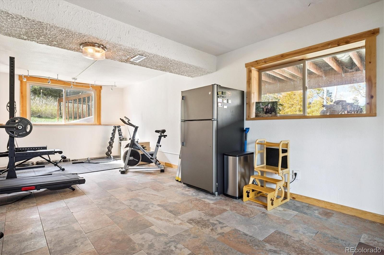 12369 Quartz Spur Conifer, CO 80433 - Photo 23 of 36 a view of a room with gym equipment