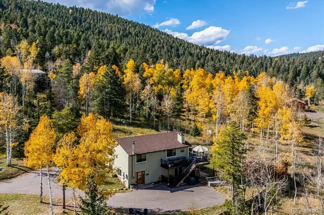 a view of a swimming pool with an outdoor seating