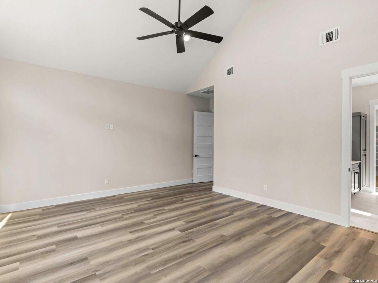1270 Misty Lane Spring Branch, TX 78070 - Photo 24 of 48 a view of a room with wooden floor and a ceiling fan