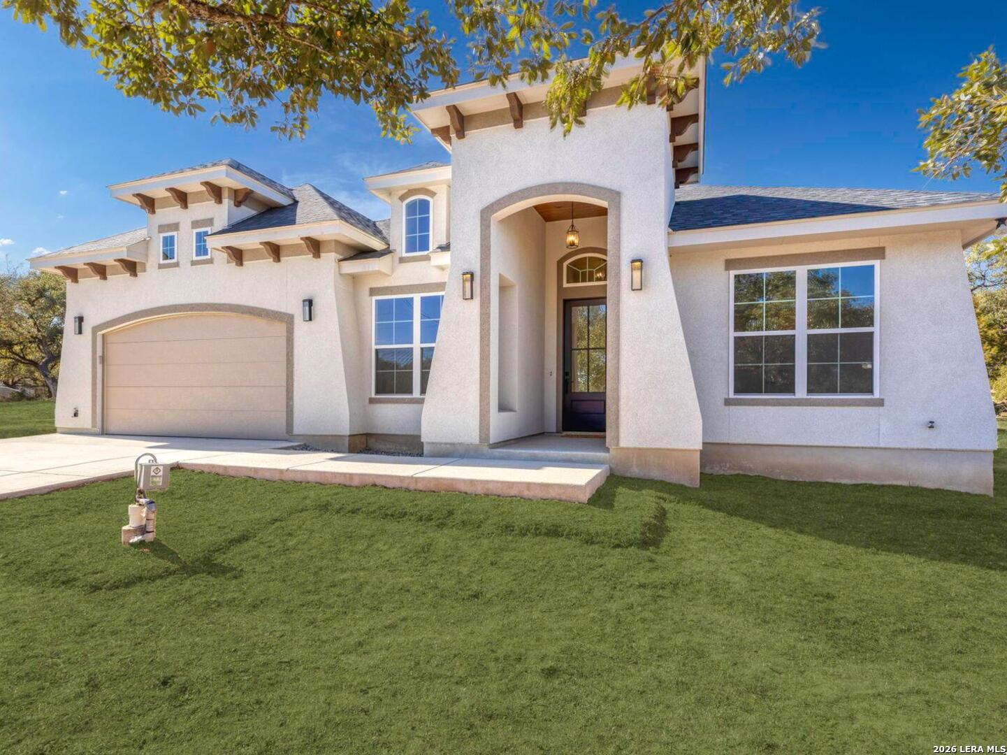 1270 Misty Lane Spring Branch, TX 78070 - Photo 3 of 48 a front view of a house with a garden
