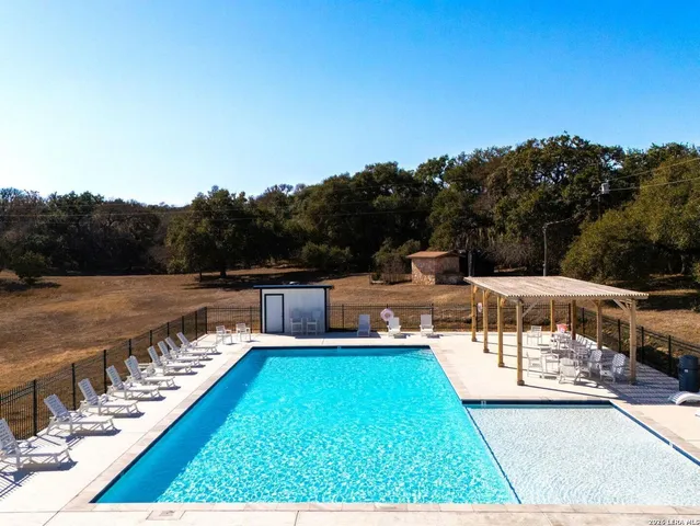 a view of a swimming pool with a patio