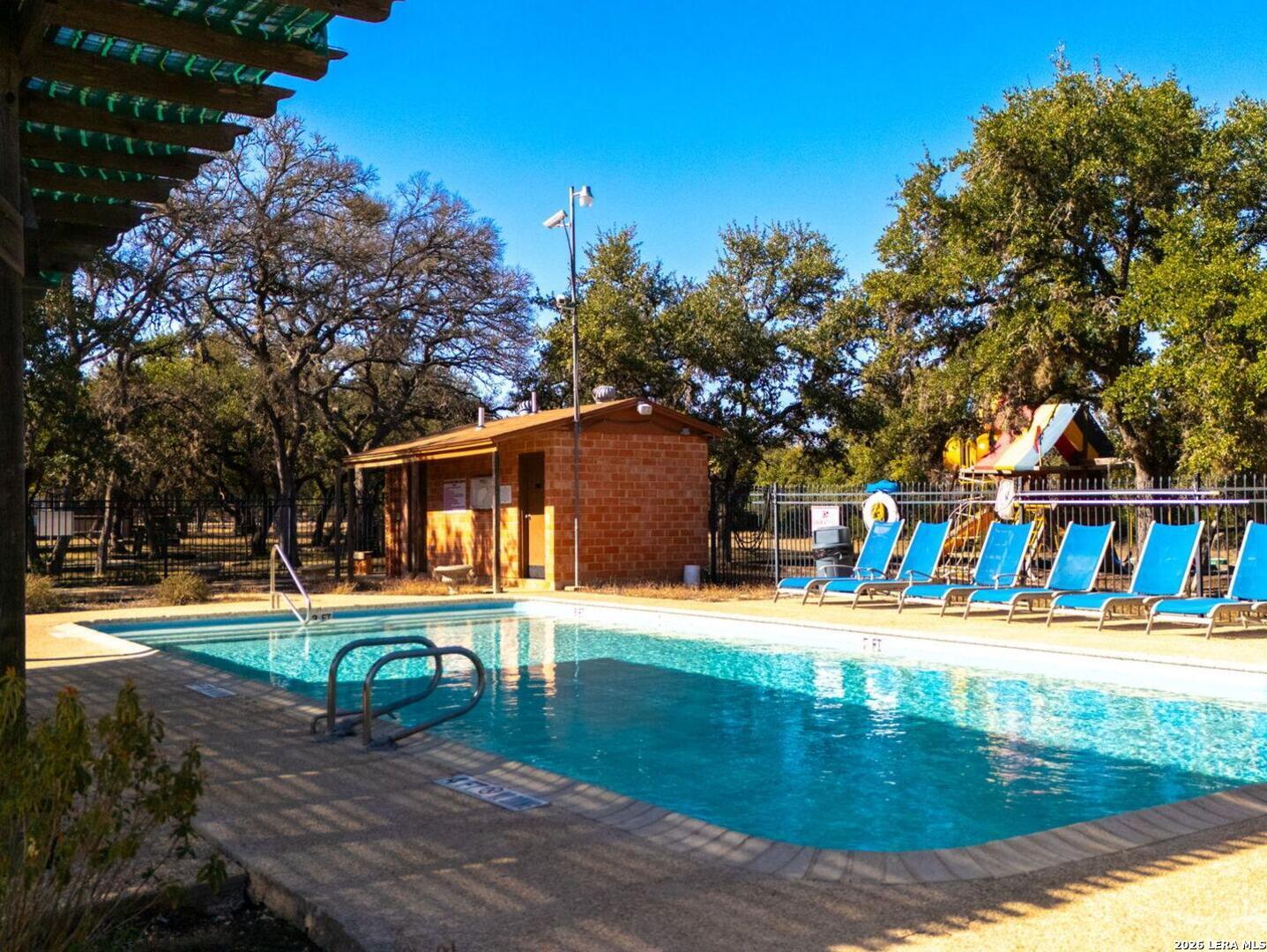 1270 Misty Lane Spring Branch, TX 78070 - Photo 48 of 48 a wooden bench sitting in front of building