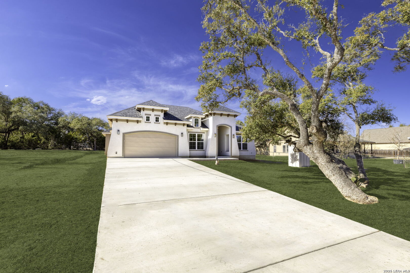 1270 Misty Lane Spring Branch, TX 78070 - Photo 7 of 48 a view of a white house with a yard