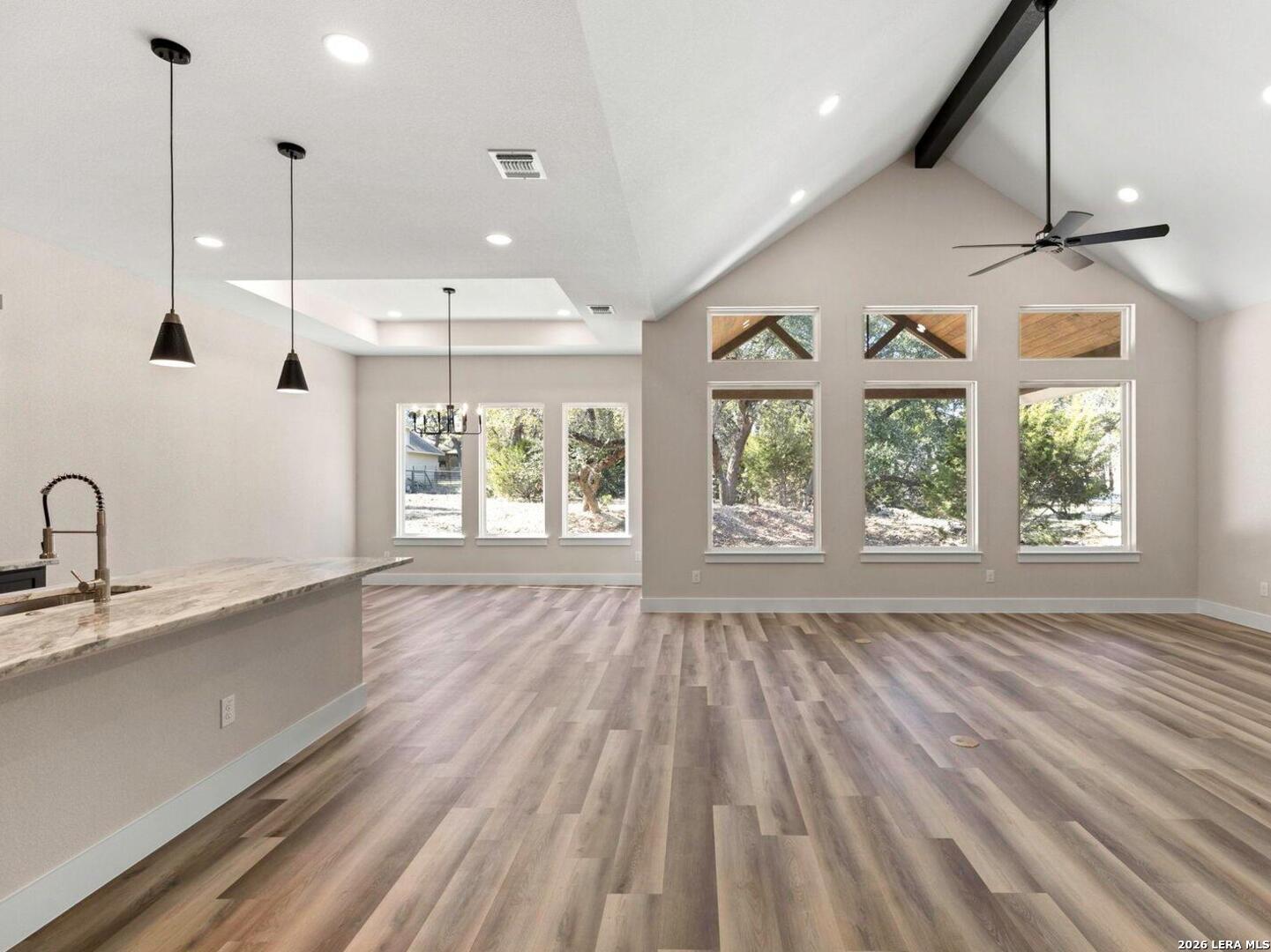 1270 Misty Lane Spring Branch, TX 78070 - Photo 9 of 48 a view of an empty room with wooden floor and a window