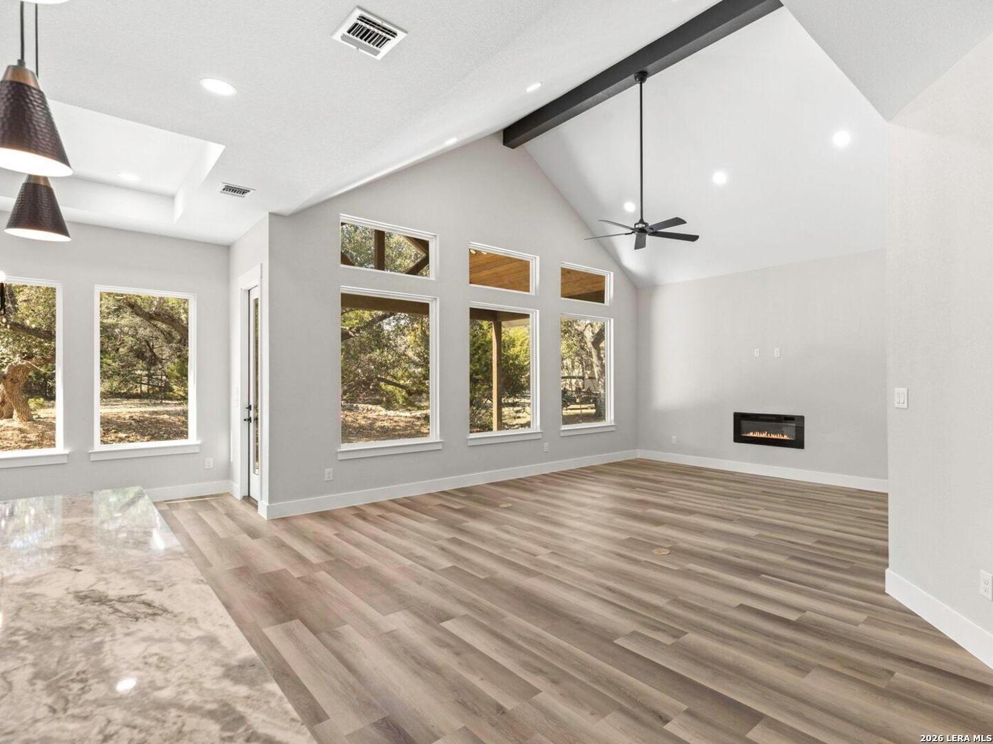 1270 Misty Lane Spring Branch, TX 78070 - Photo 10 of 48 a view of an empty room with a window and wooden floor
