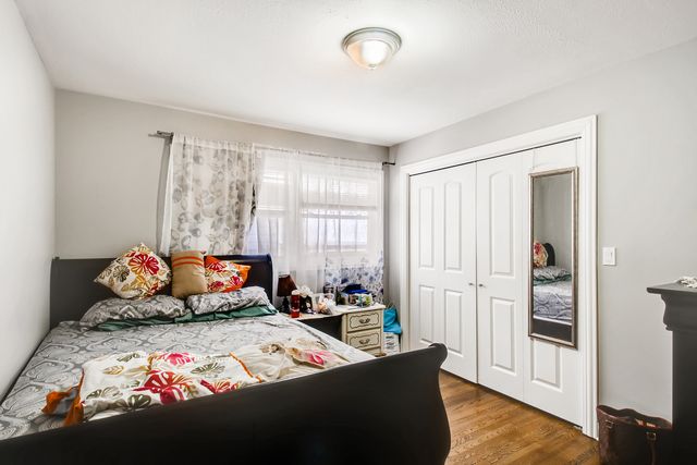 a bedroom with bed and window