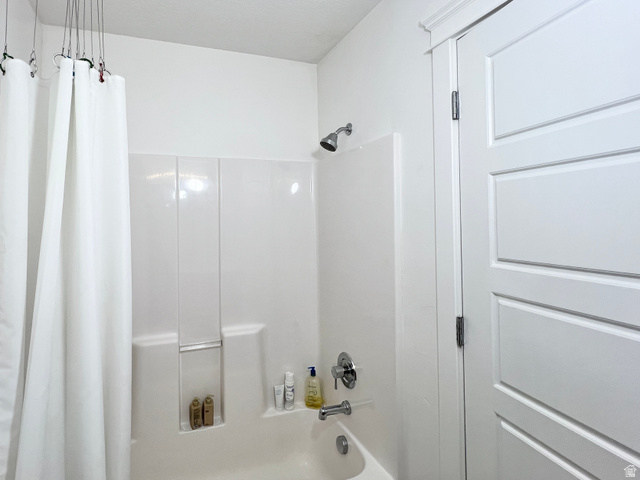 1017 South 275 West Logan, UT 84321 - Photo 19 of 36 Bathroom with shower / bathtub combination with curtain