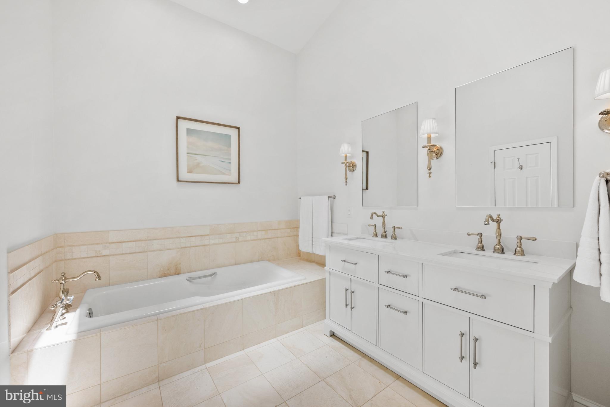 3604 Winfield Lane Northwest Washington, DC 20007 - Photo 23 of 35 a spacious bathroom with a tub sink and mirror