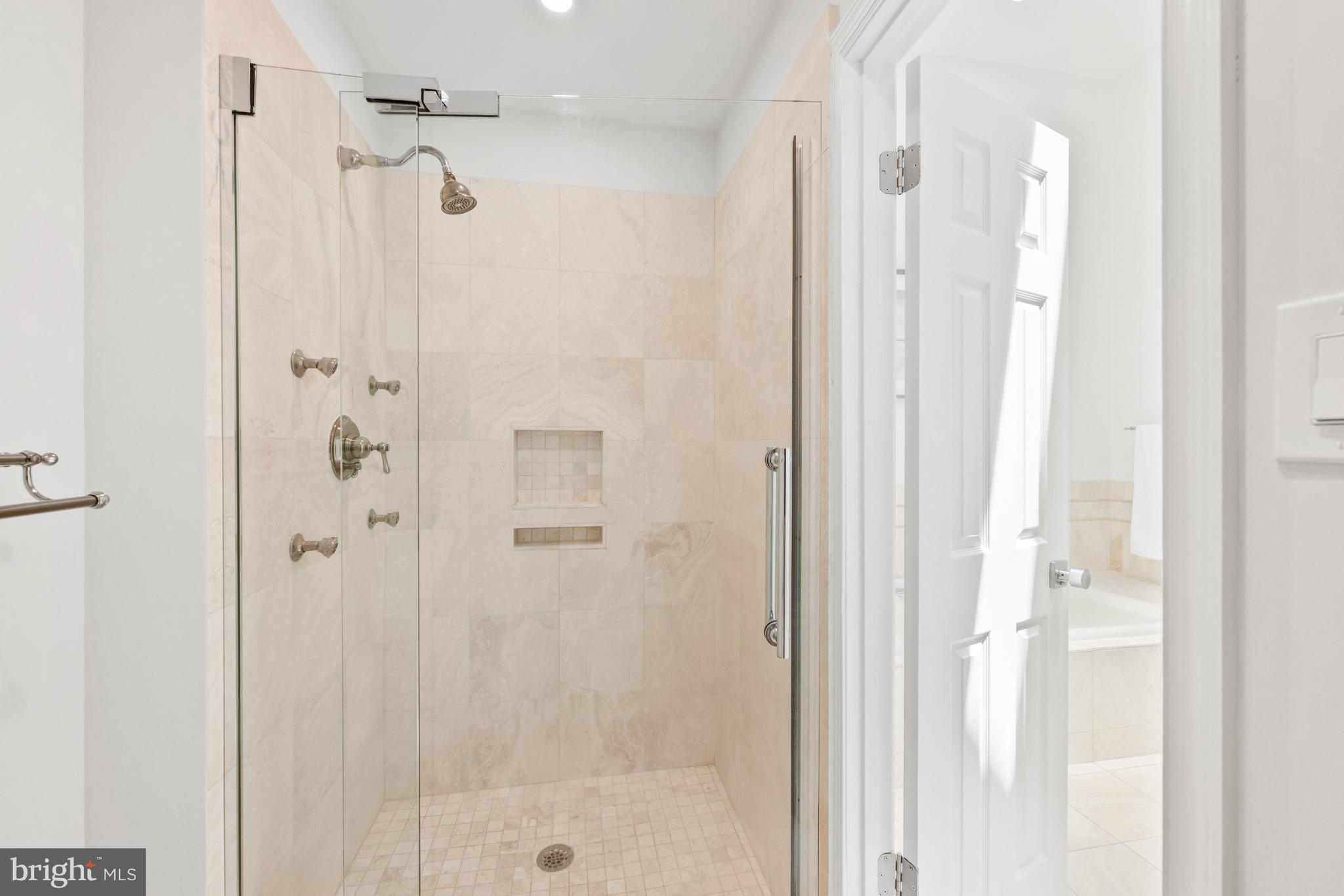 3604 Winfield Lane Northwest Washington, DC 20007 - Photo 24 of 35 a bathroom with a glass shower door