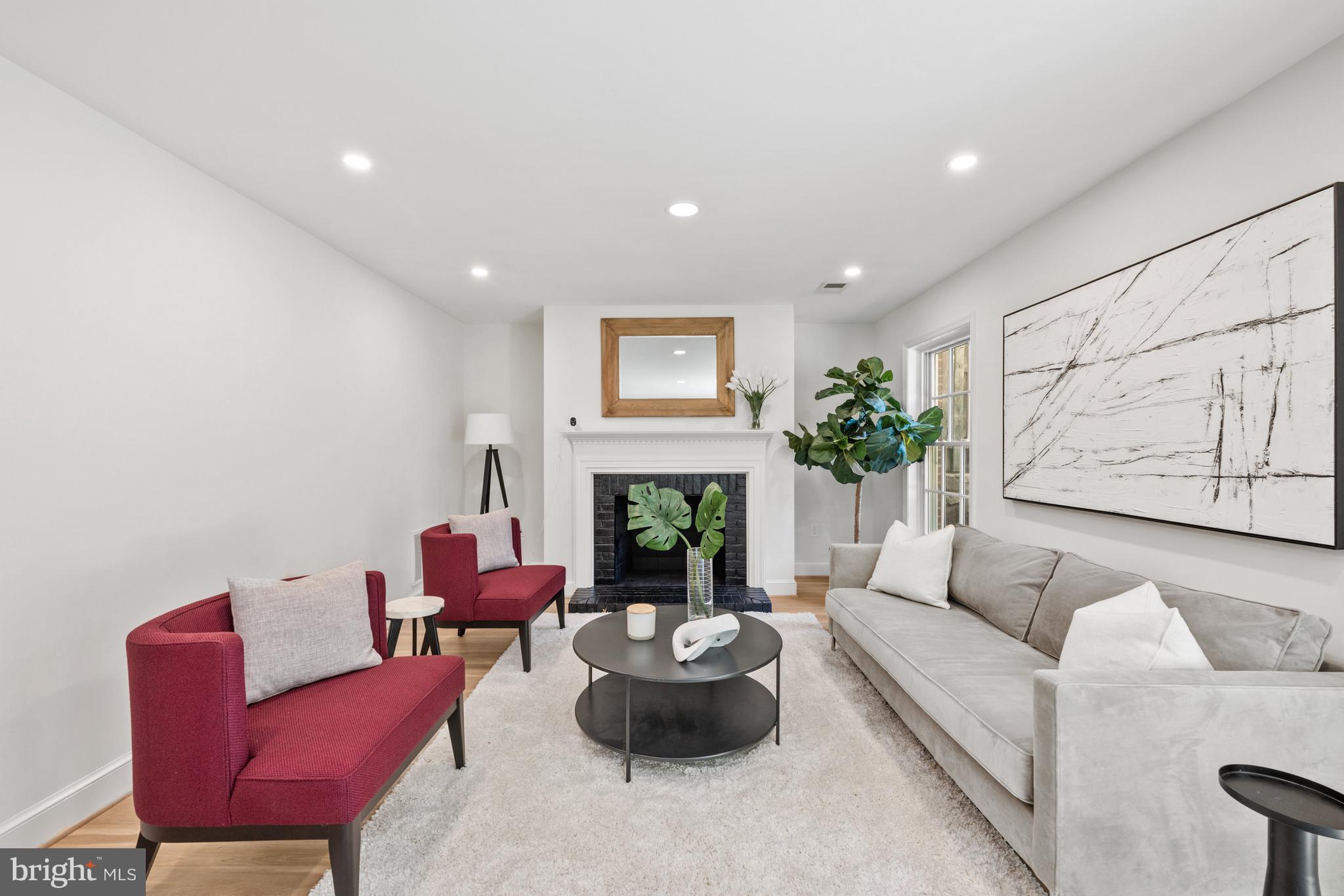 3604 Winfield Lane Northwest Washington, DC 20007 - Photo 28 of 35 a living room with furniture and a fireplace