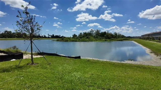 a front view of a house with swimming pool outdoor seating and barbeque oven