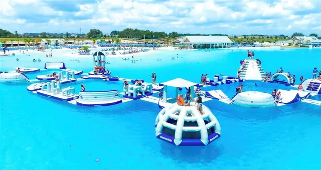 a view of a swimming pool with an outdoor seating