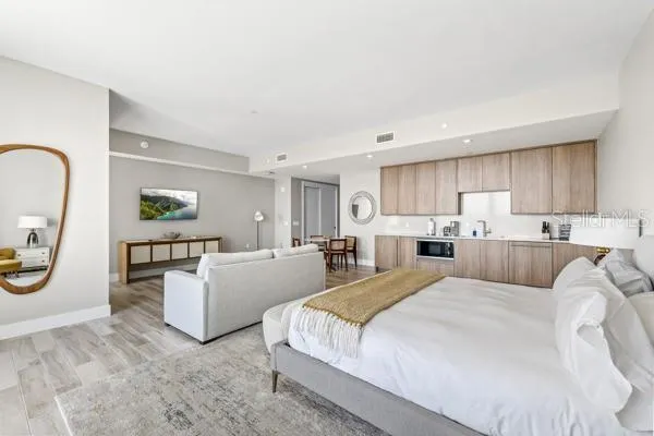 a bed room with furniture and a window