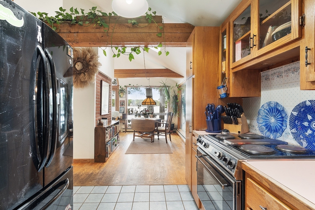 151 Flynn Road Lunenburg, MA 01462 - Photo 26 of 41 a kitchen with stainless steel appliances granite countertop a refrigerator and a stove