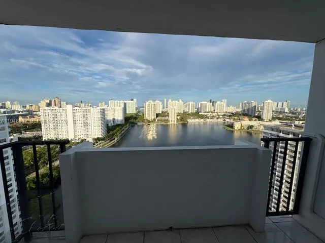 a view of swimming pool with outdoor seating and plants