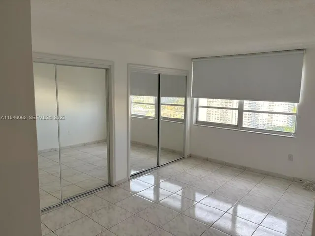 a view of an empty room with window