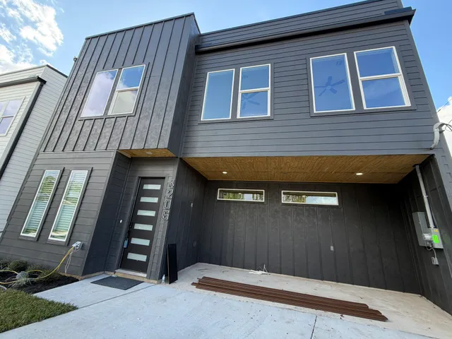 a front view of a house with yard