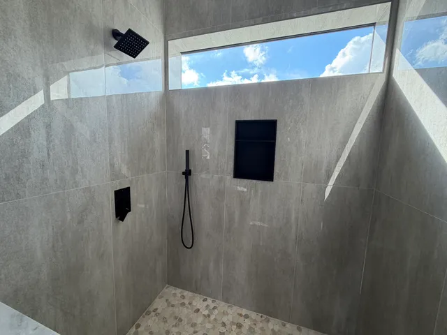 an empty room with wooden floor and closet