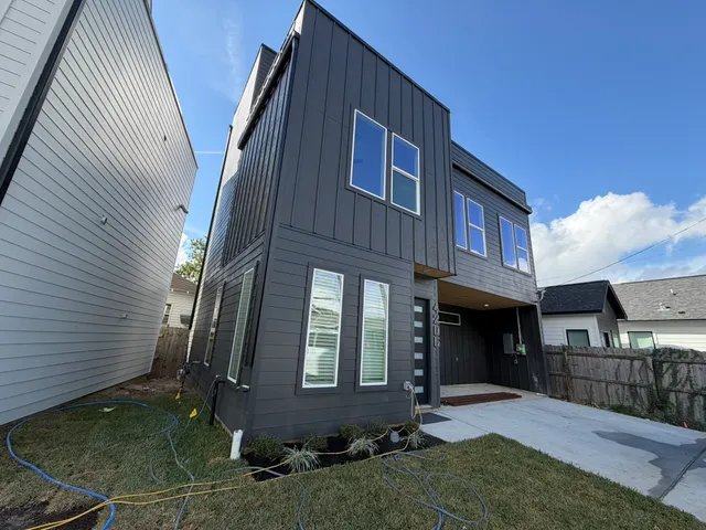 a room with wooden floor and a window