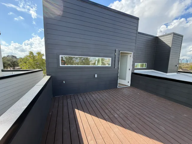 a picture of a bathroom with a window and mirror