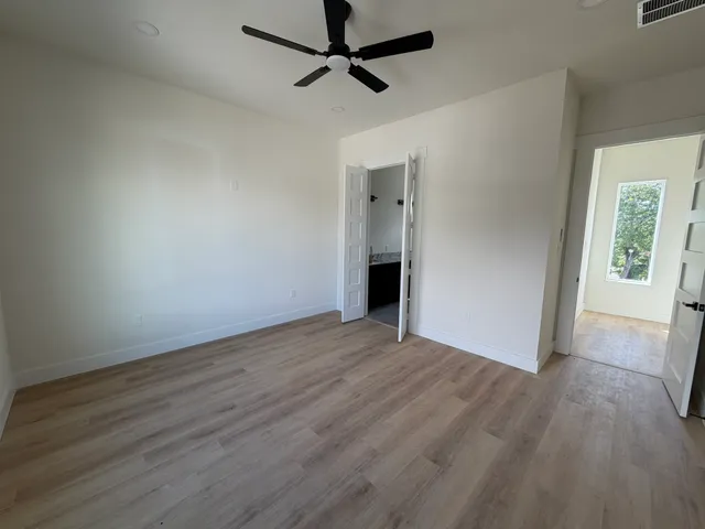 a bathroom with a double vanity sink toilet and shower