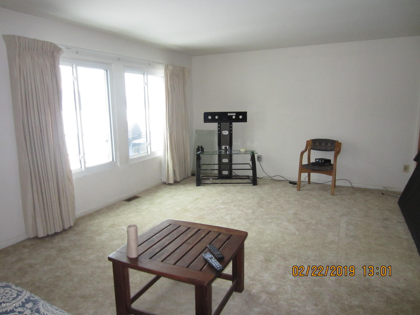 36 East Beach Road Richmond, MA 01201 - Photo 2 of 15 a room with a chair and gym equipment