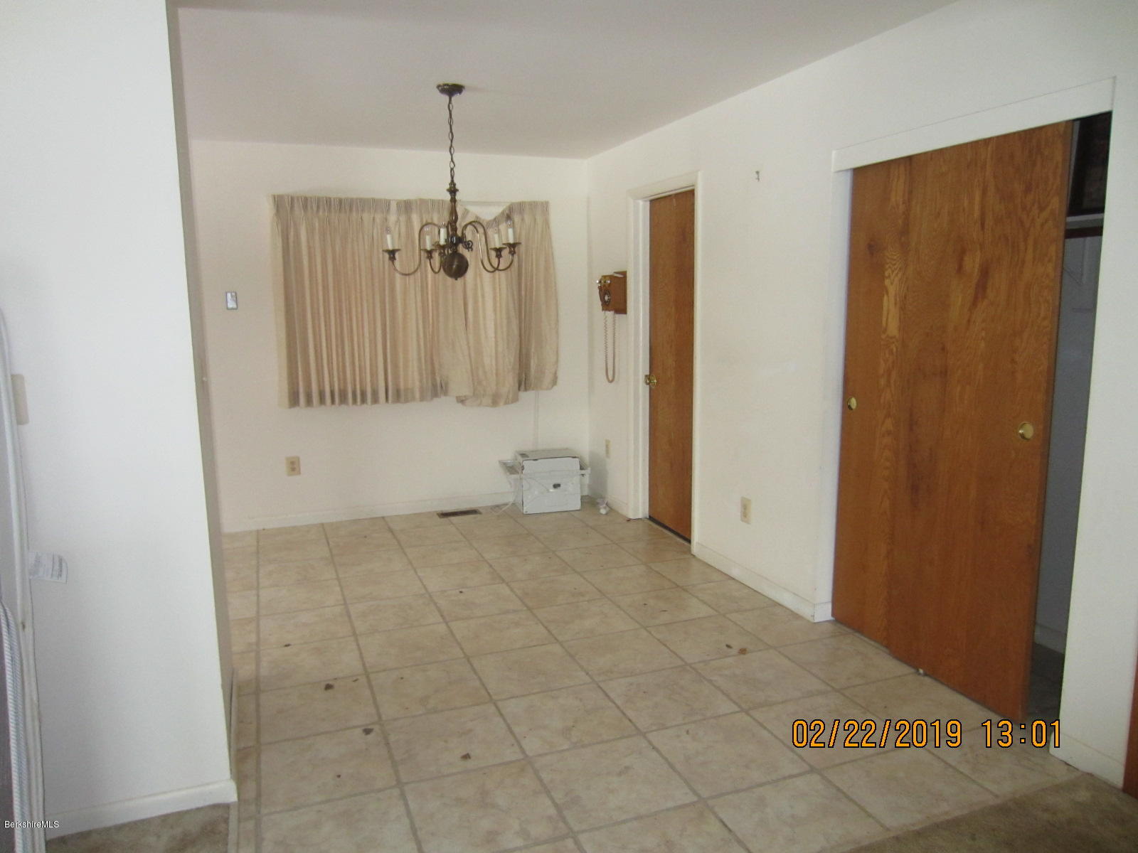 36 East Beach Road Richmond, MA 01201 - Photo 4 of 15 a view of a hallway with a chandelier