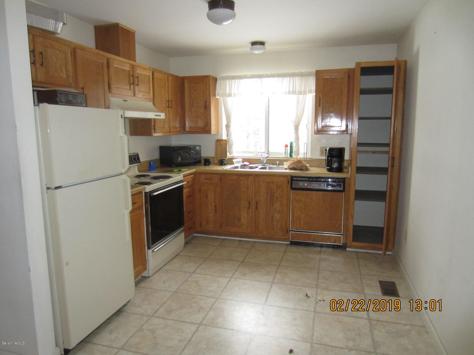 36 East Beach Road Richmond, MA 01201 - Photo 5 of 15 a kitchen with granite countertop a refrigerator stove top oven and sink