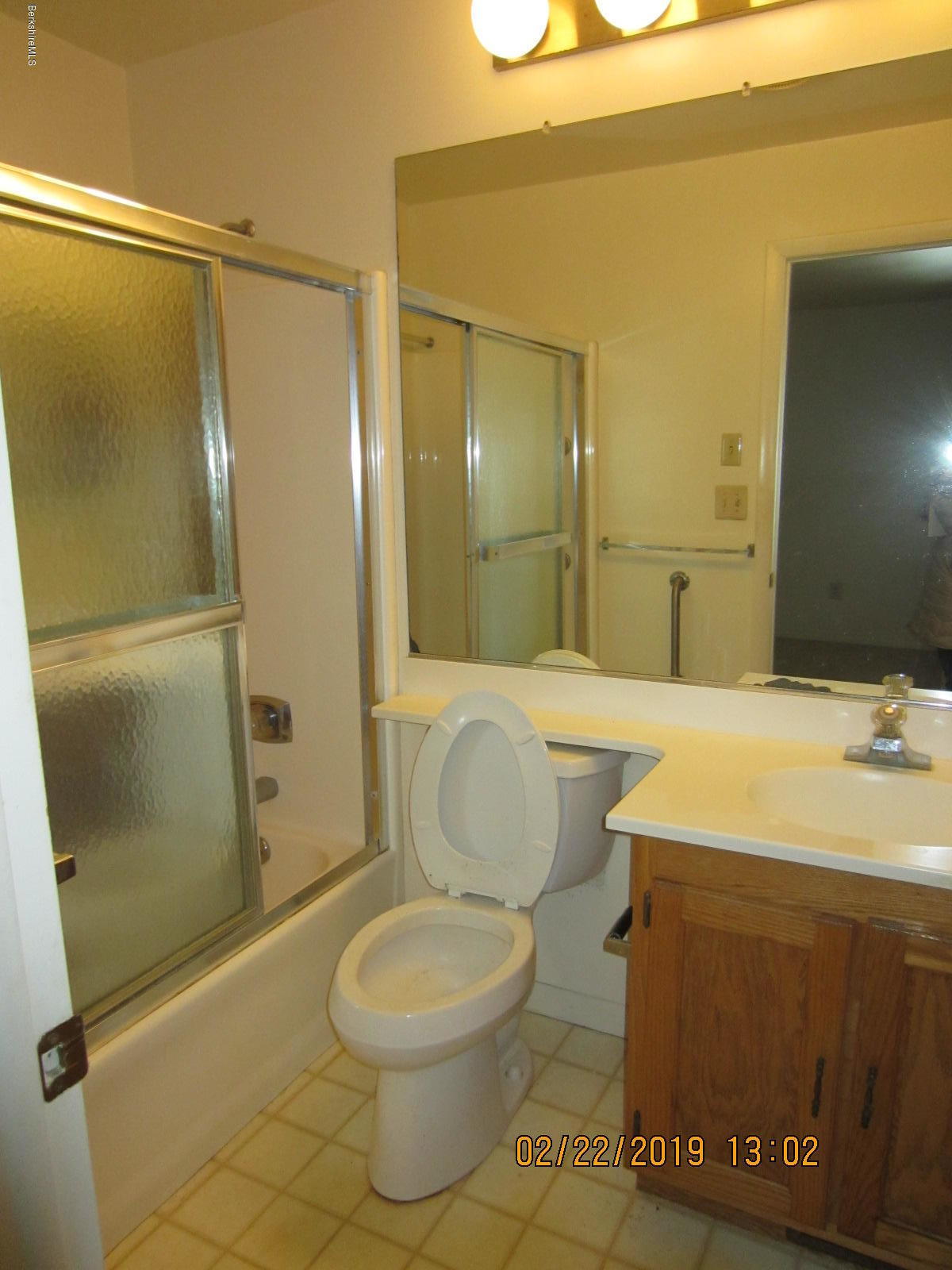 36 East Beach Road Richmond, MA 01201 - Photo 9 of 15 a bathroom with a sink a toilet and shower