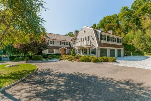 82 Middlebrook Farm Road Wilton, CT 06897 - Photo 1 of 1 a front view of a house with a yard and swimming pool