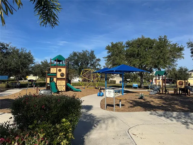 a view of swimming pool with a yard and lake view
