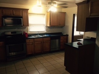 3911 Merioneth Drive Crete, IL 60417 - Photo 12 of 19 a kitchen with a sink cabinets and stainless steel appliances