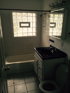 3911 Merioneth Drive Crete, IL 60417 - Photo 15 of 19 a bathroom with a bathtub and a window