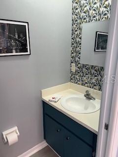 9951 Southwest 88th Court Road, Unit G Ocala, FL 34481 - Photo 13 of 38 a bathroom with a sink and a mirror