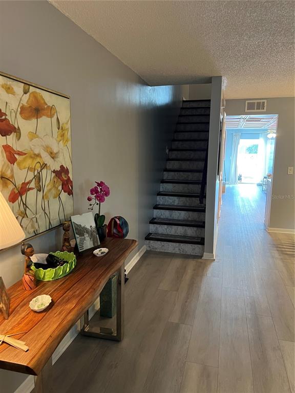 9951 Southwest 88th Court Road, Unit G Ocala, FL 34481 - Photo 18 of 38 a room with toys and wooden floor