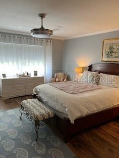 9951 Southwest 88th Court Road, Unit G Ocala, FL 34481 - Photo 19 of 38 a bedroom with a bed and window