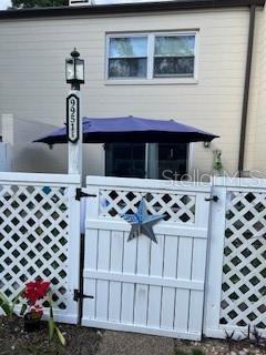 9951 Southwest 88th Court Road, Unit G Ocala, FL 34481 - Photo 28 of 38 a kitchen with a sink a stove and cabinets