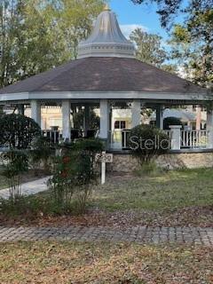 9951 Southwest 88th Court Road, Unit G Ocala, FL 34481 - Photo 31 of 38 a front view of a house with garden