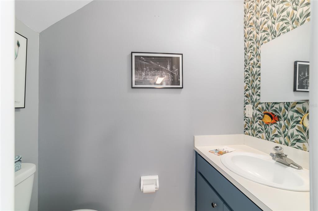 9951 Southwest 88th Court Road, Unit G Ocala, FL 34481 - Photo 31 of 59 a bathroom with a sink and a mirror