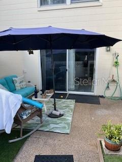 9951 Southwest 88th Court Road, Unit G Ocala, FL 34481 - Photo 33 of 38 a view of a living room filled with furniture and a potted plant