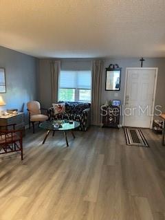 9951 Southwest 88th Court Road, Unit G Ocala, FL 34481 - Photo 4 of 38 a living room with furniture and a window