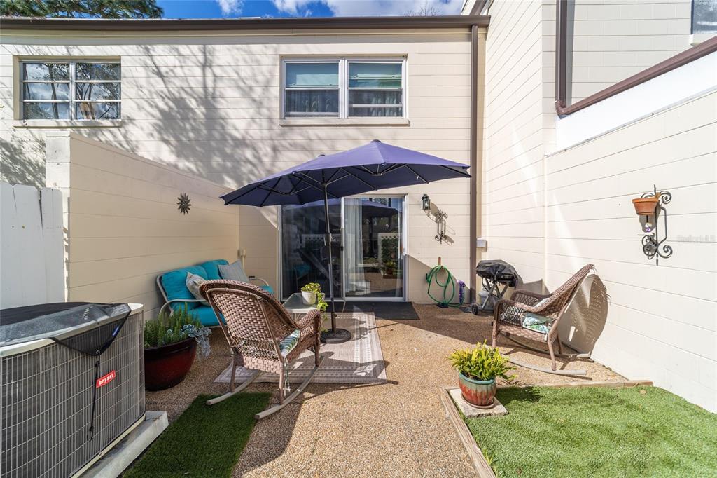 9951 Southwest 88th Court Road, Unit G Ocala, FL 34481 - Photo 50 of 59 a building outdoor space with patio furniture