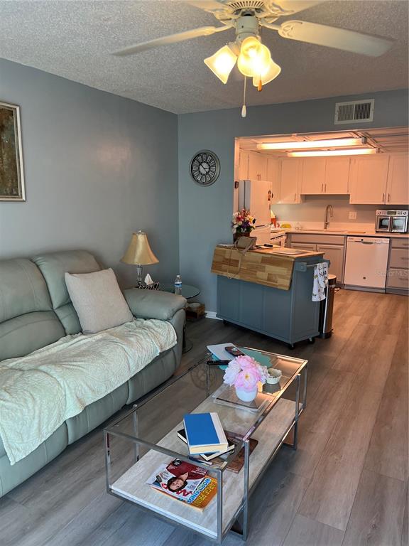 9951 Southwest 88th Court Road, Unit G Ocala, FL 34481 - Photo 9 of 38 a living room with furniture and a large window